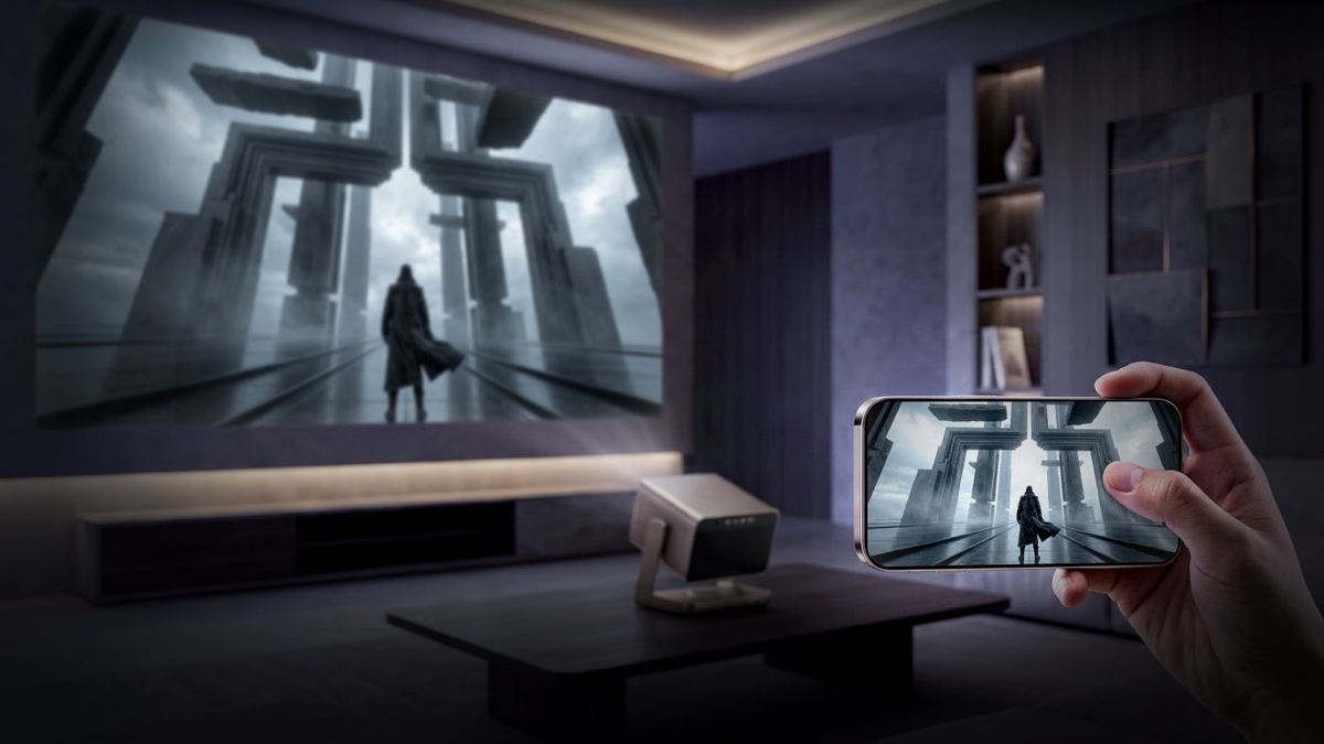 Phone held horizontally showing the same science-fiction scene as the projection on the wall.